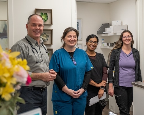 A Bluewater physician and three members of the research team together at the clinic